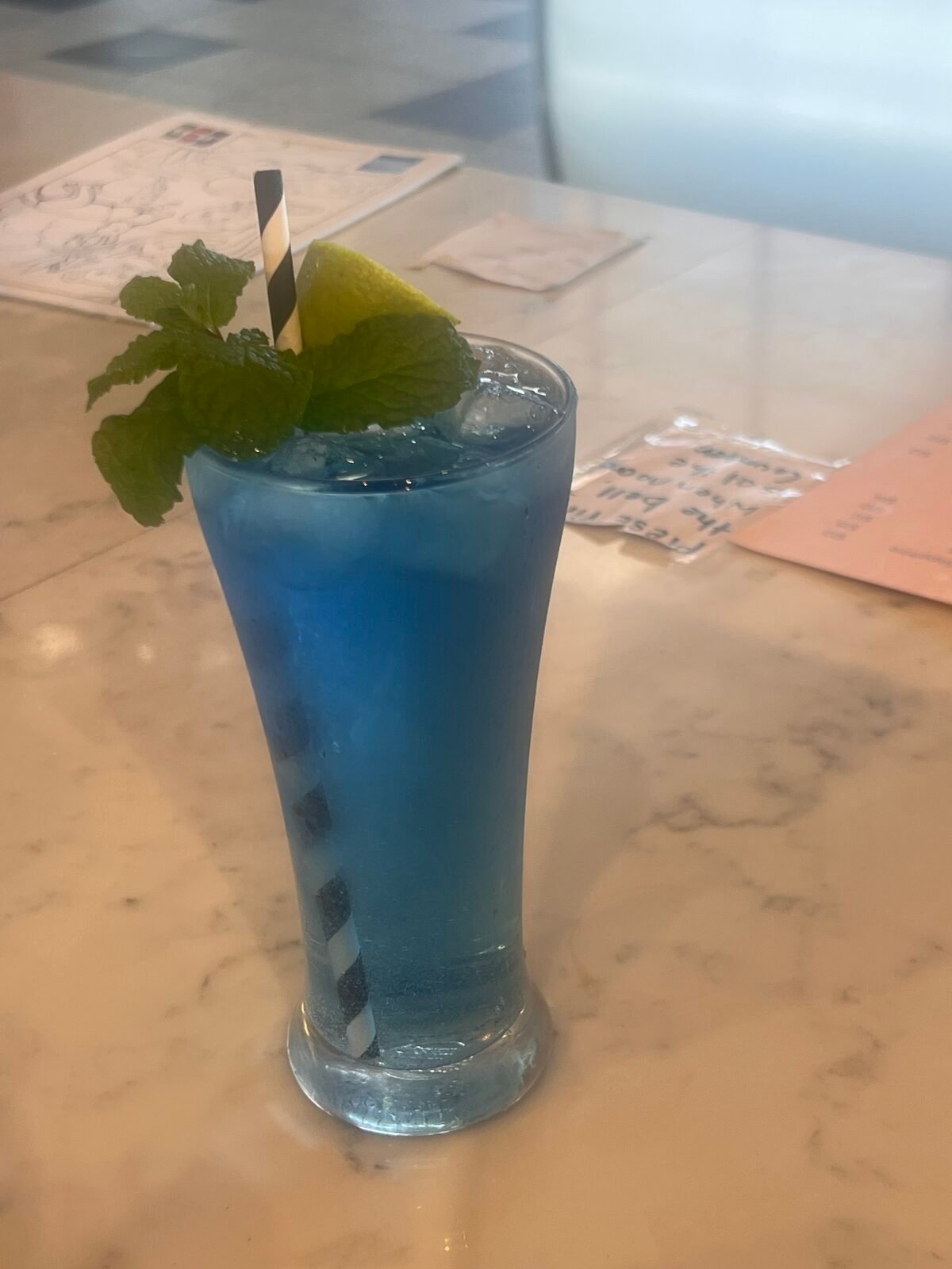 Blue mocktail with mint and lime