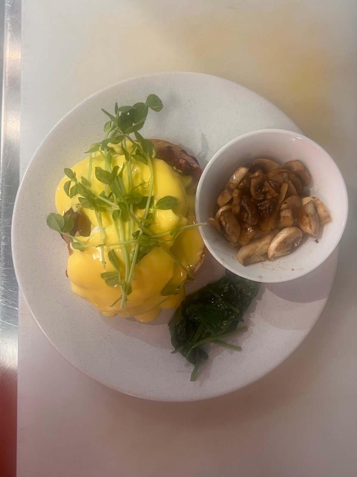 Eggs benedict with mushrooms and spinach