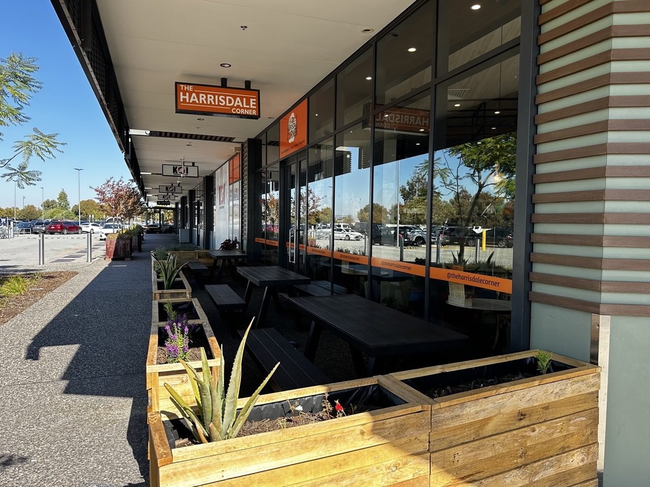 The Harrisdale Corner outdoor seating and storefront